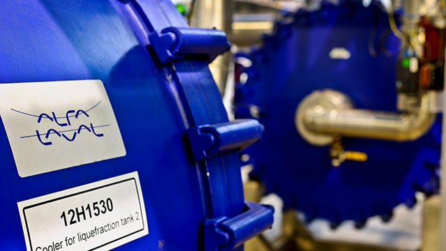 Close up of two blue Alfa Laval welded spiral heat exchangers